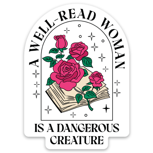 A die-cut sticker with a white background featuring an arched graphic. The design shows four pink roses with green leaves above an open book, with the text 'A WELL-READ WOMAN IS A DANGEROUS CREATURE' in black lettering.