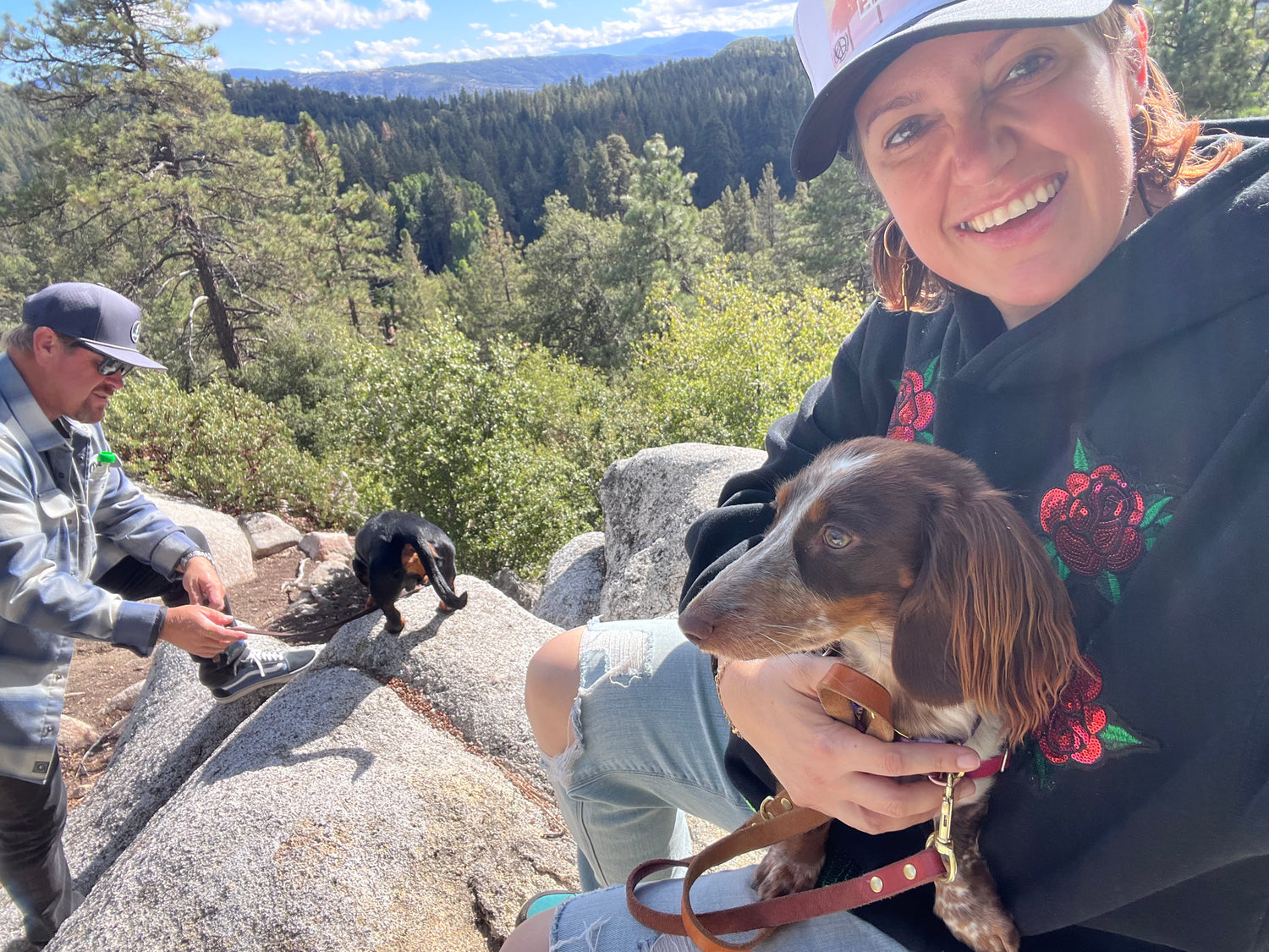 Tanya with her husband and two weenie dogs